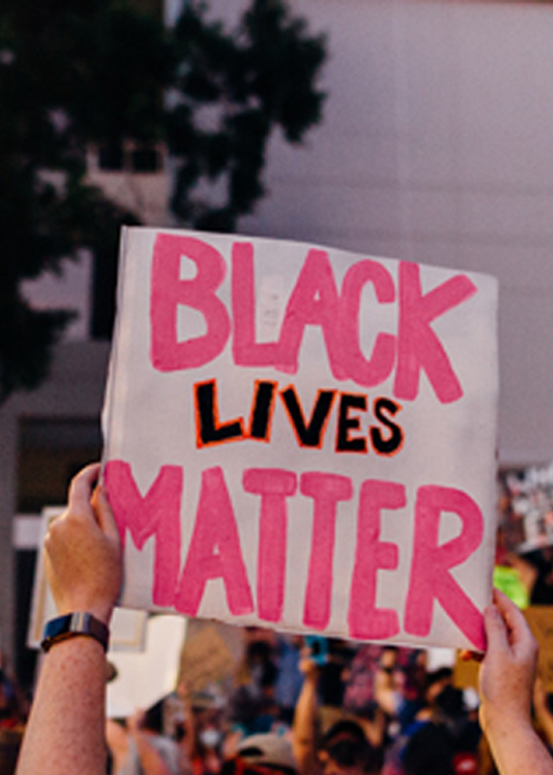 someone holding a sign with the words 'black lives matter'