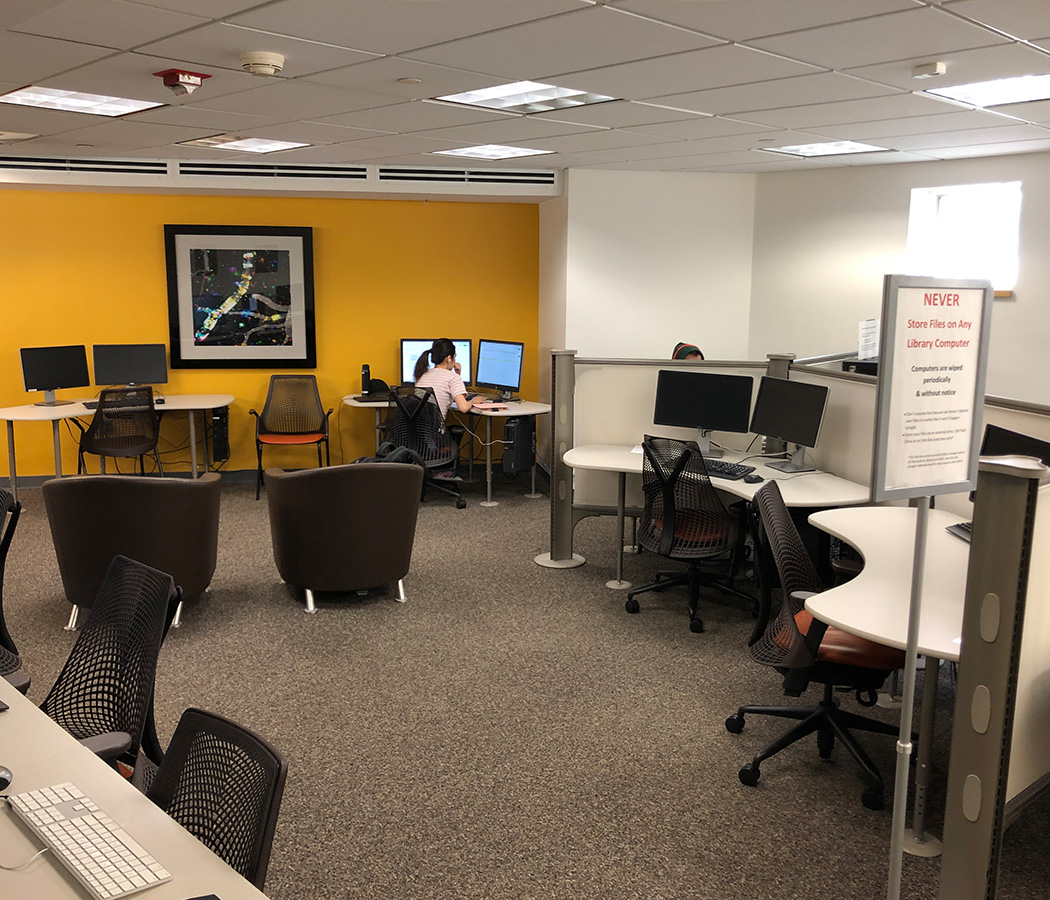 medical library's 24/7 room featuring a yellow wall, soft seating, and computer work stations