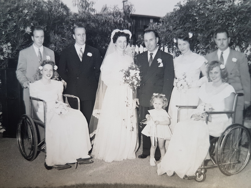 Wedding photo with 2 women in wheelchairs