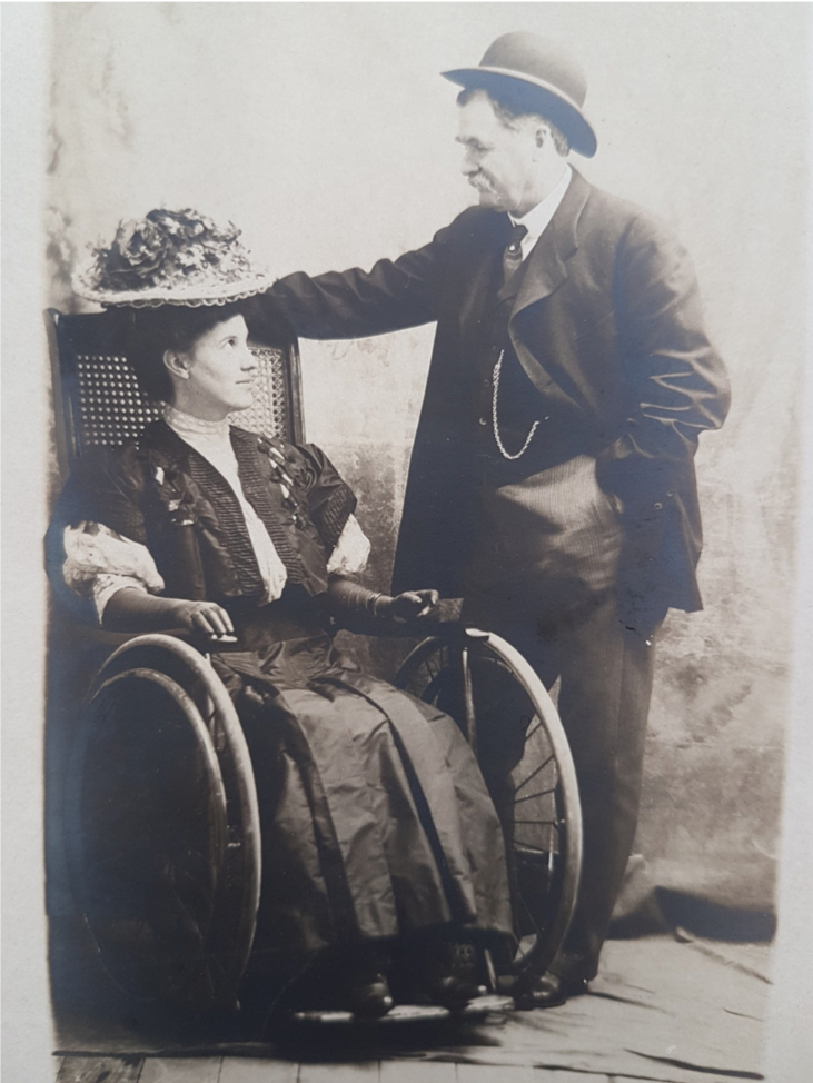 Man with woman in wheelchair