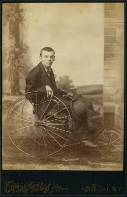 Victorian-era boy in a wheelchair