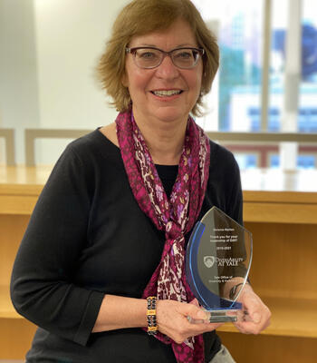 Melanie Norton holds the outstanding leadership award from co-chairing Yale's Diversability group