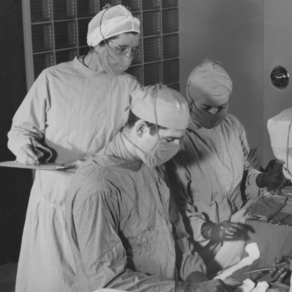 a woman in scrubs drawing