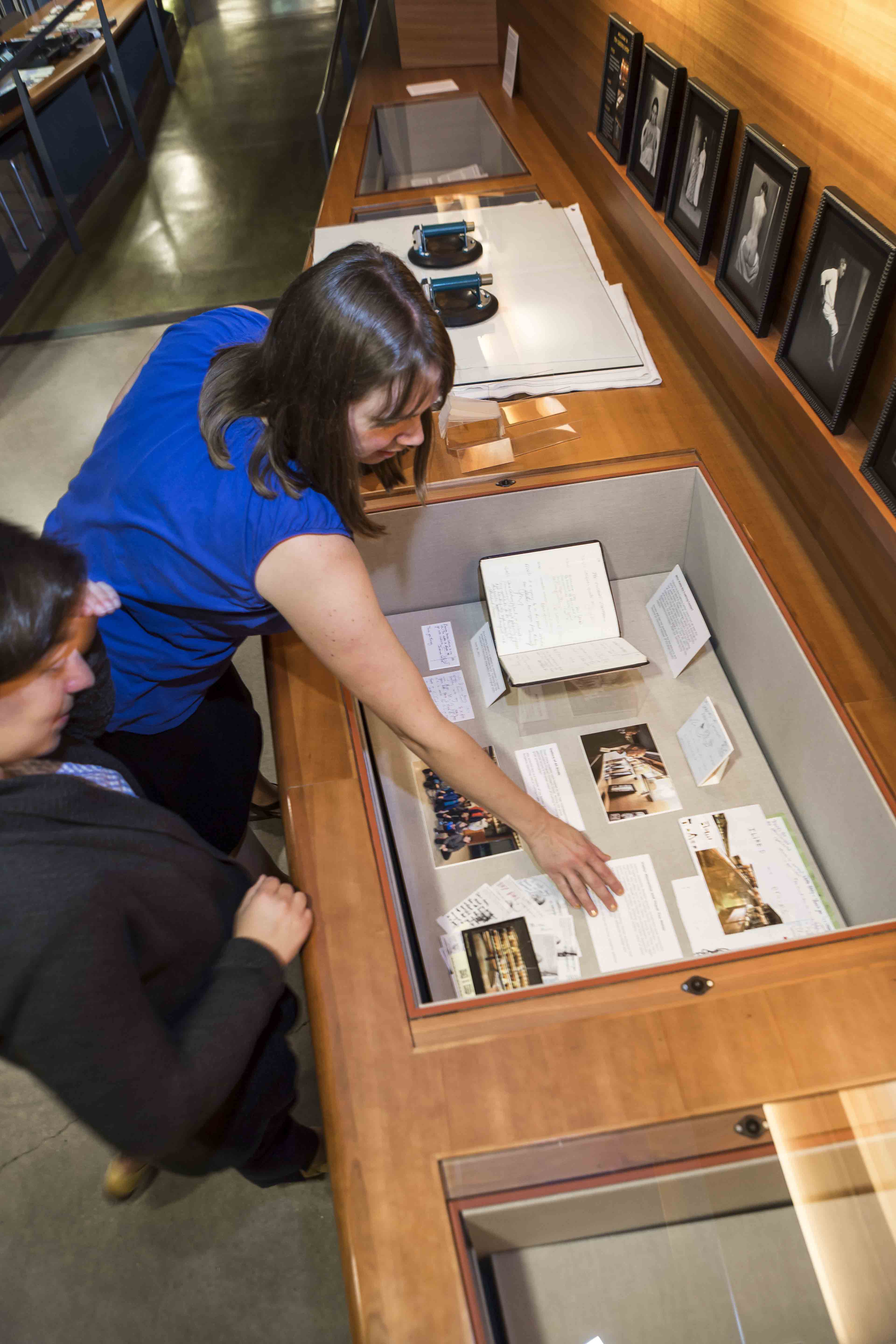 installation of exhibit, Celebraring 10 years of the, Cushing Center, Exhibit, Cushing Center display cases, Curated by Terry Dagradi & Deborah Streahle with support from Melissa Grafe